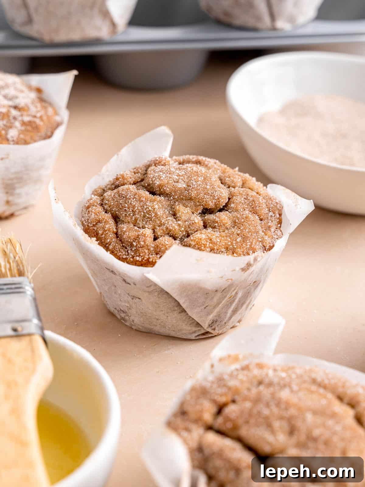 A banana bread muffin with cinnamon sugar topping.