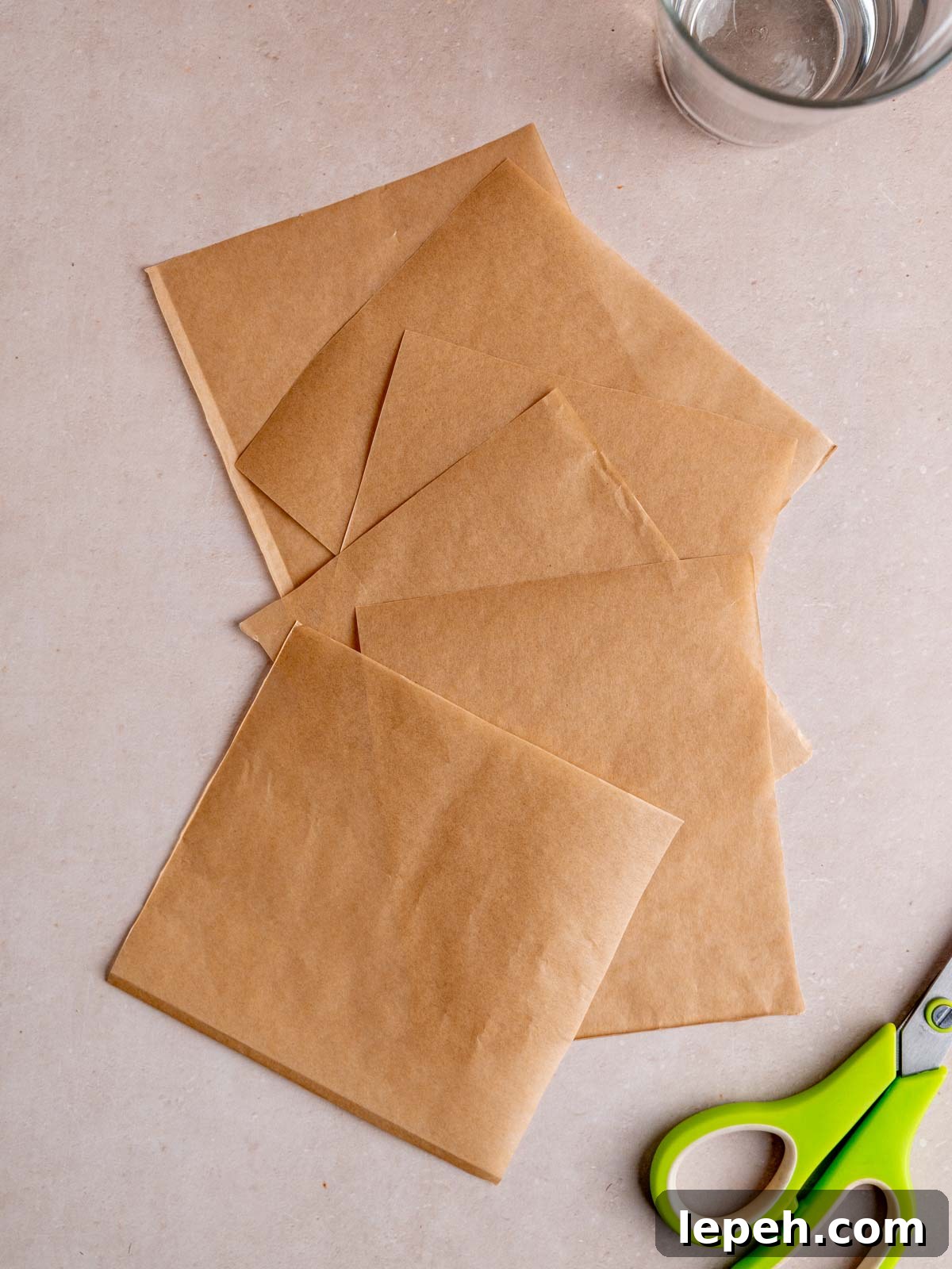Parchment paper cut into 6 equal squares.