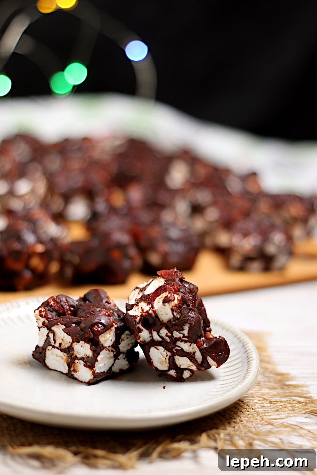 Two Chocolate Cherry Marshmallow Squares on a small white plate.