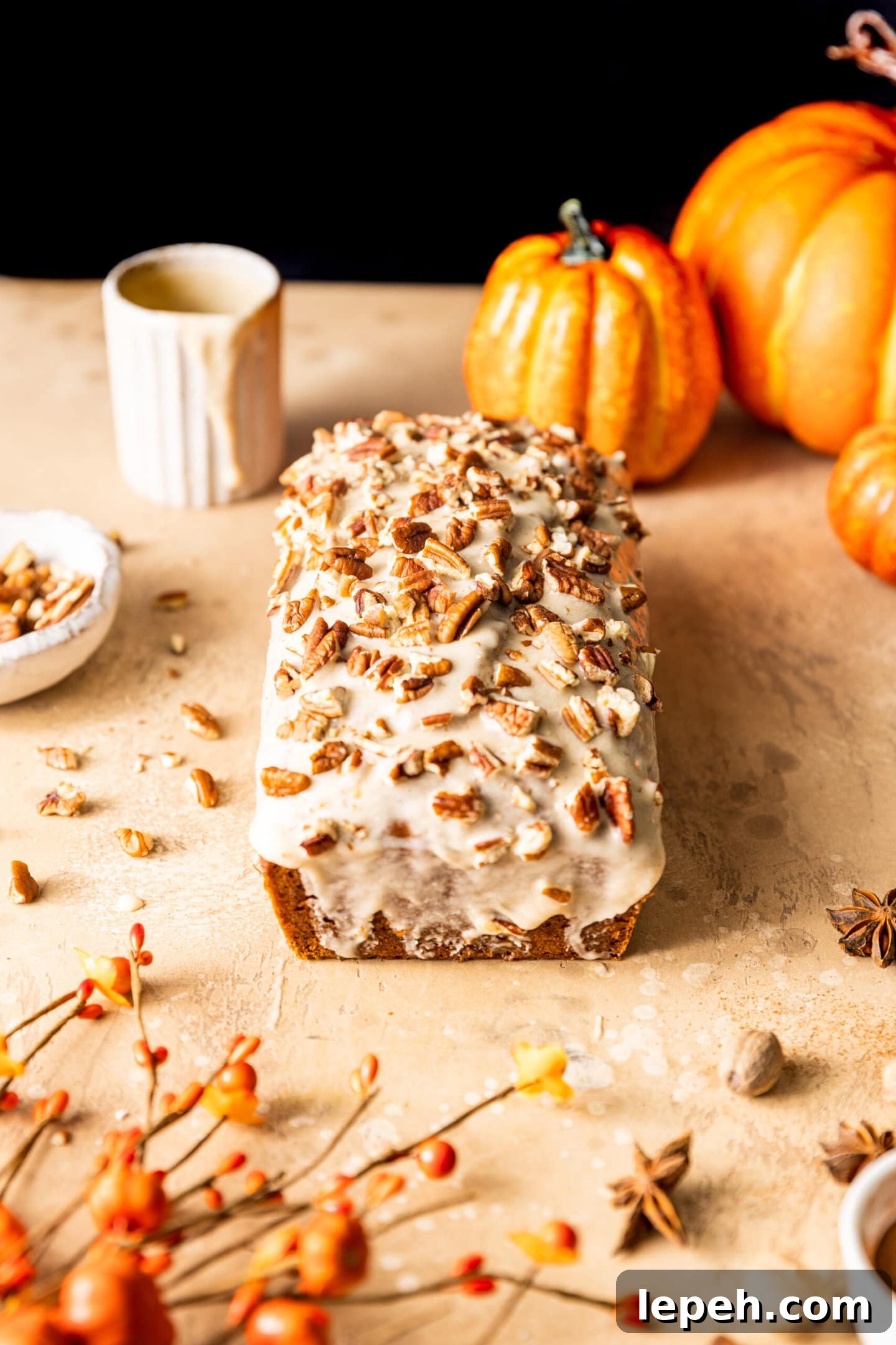 Maple Glazed Pumpkin Bread with pecans on top
