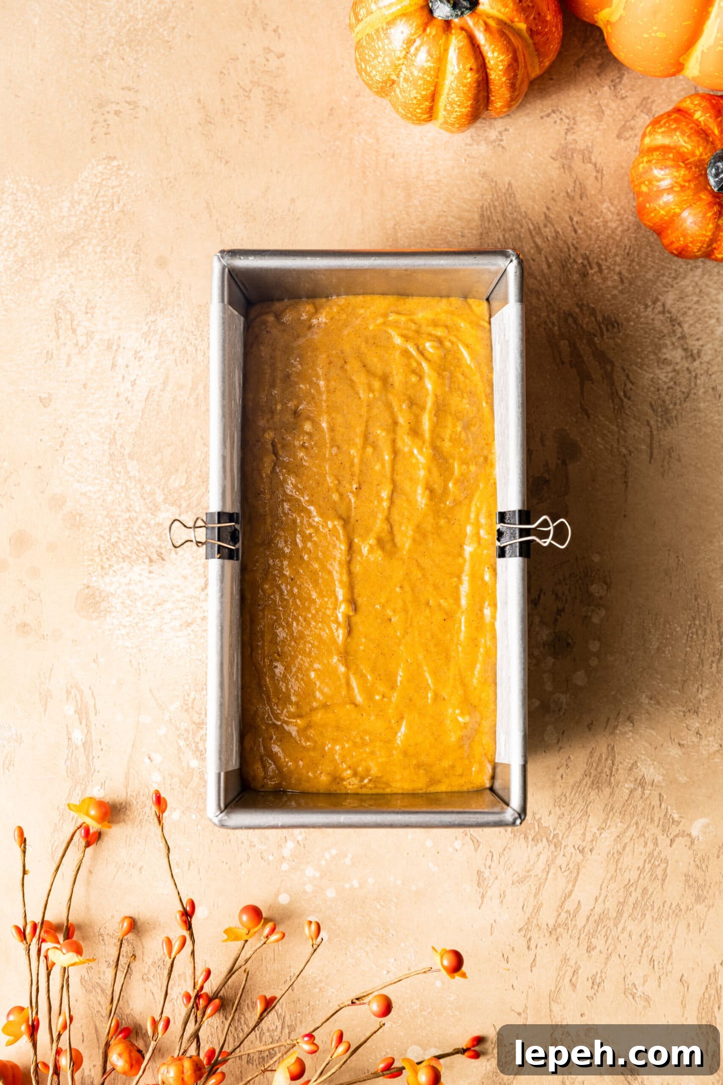 Pumpkin bread batter inside loaf pan