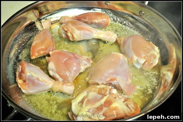 Chicken pieces are seared in olive oil and butter.