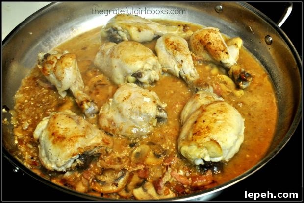 Wine is added to skillet for coq au vin sauce.