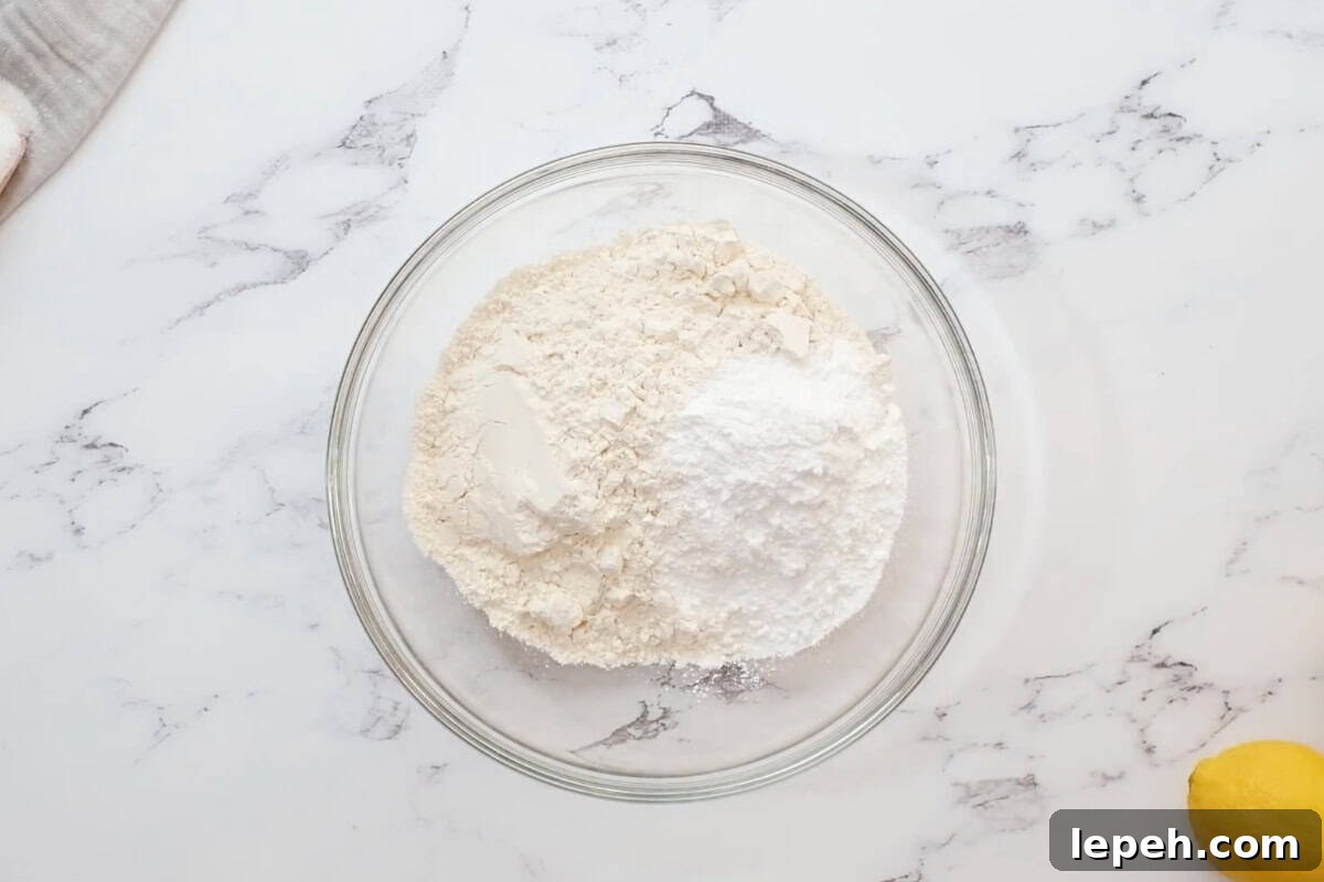 flour and powdered sugar in a glass bowl.