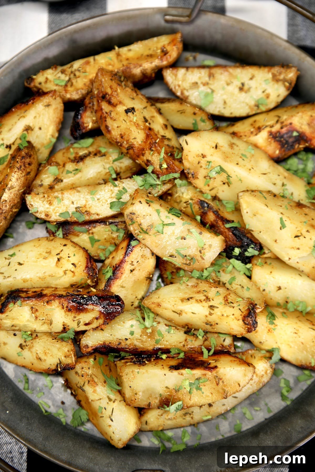 Pan of roasted potato wedges.
