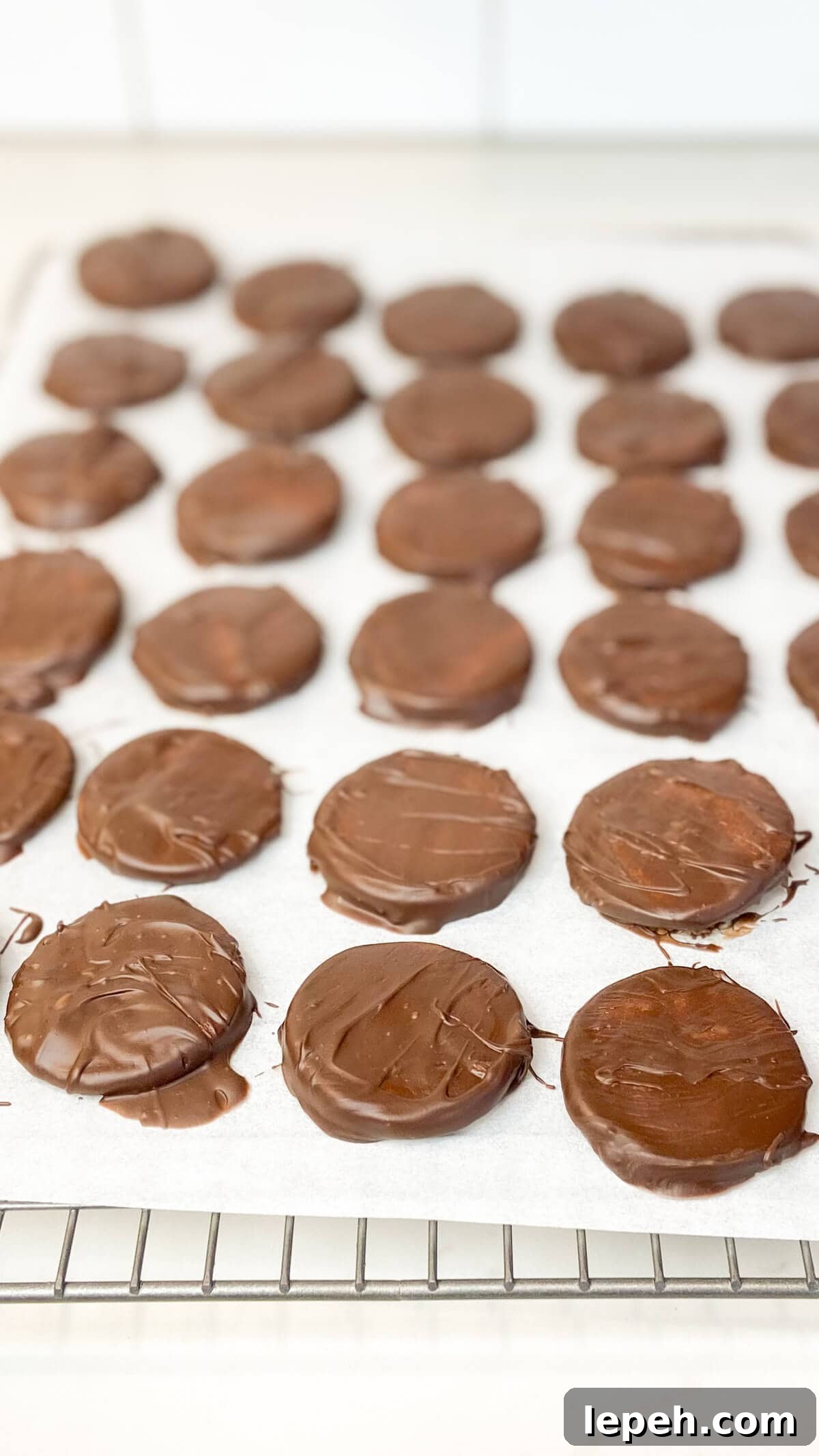 Chocolate setting on dipped cookies.