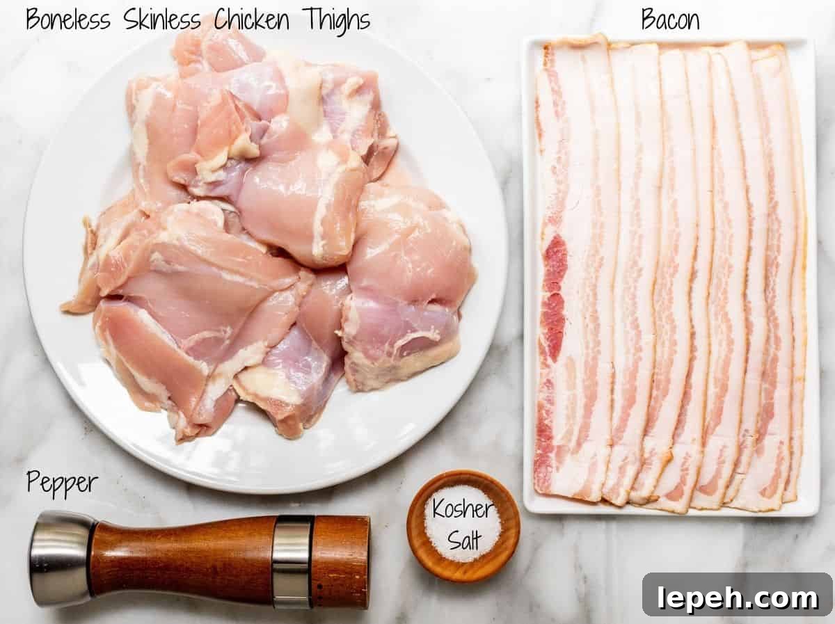 Boneless Skinless Chicken Thighs Ingredients on a white marble board.