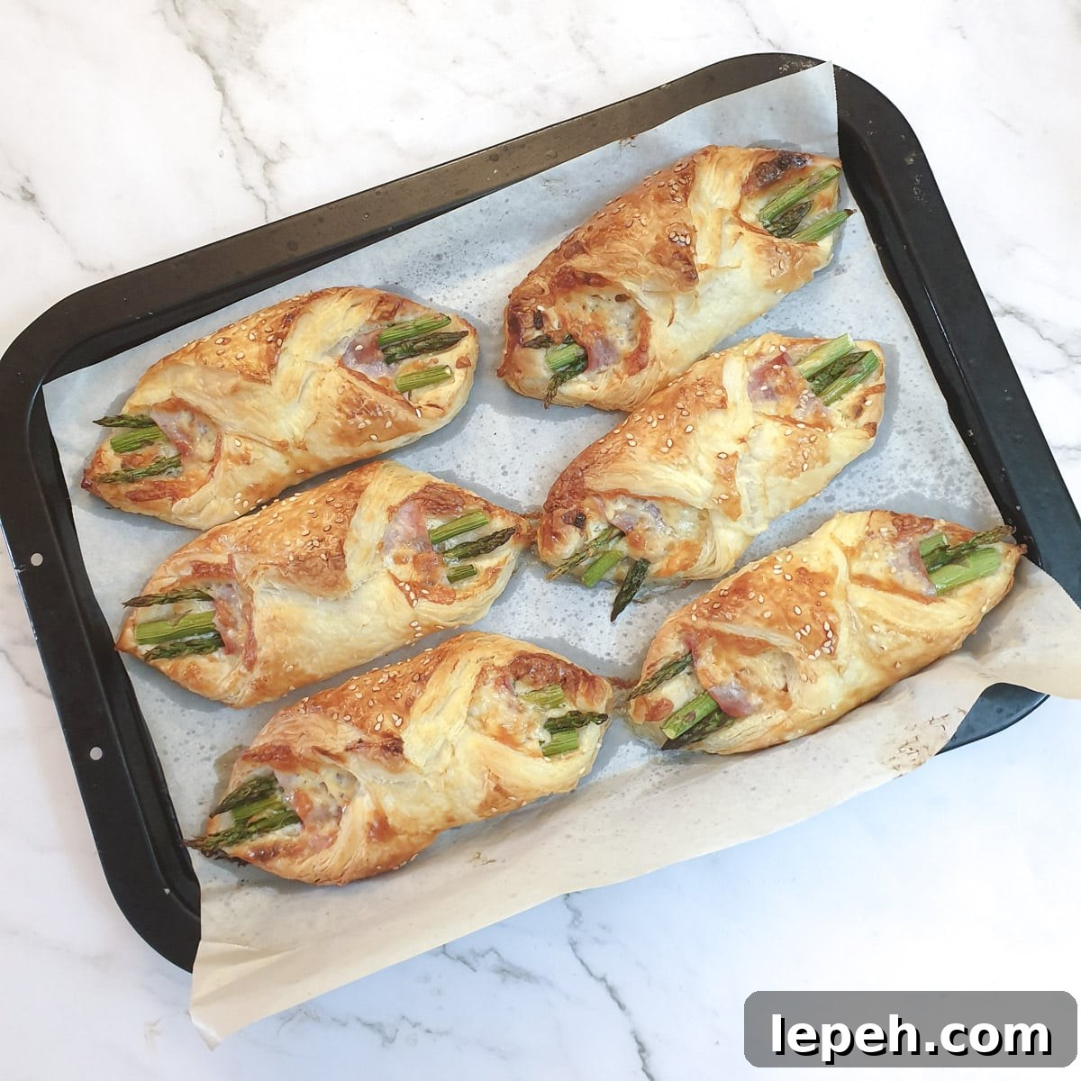 6 baked ham and asparagus bundles.