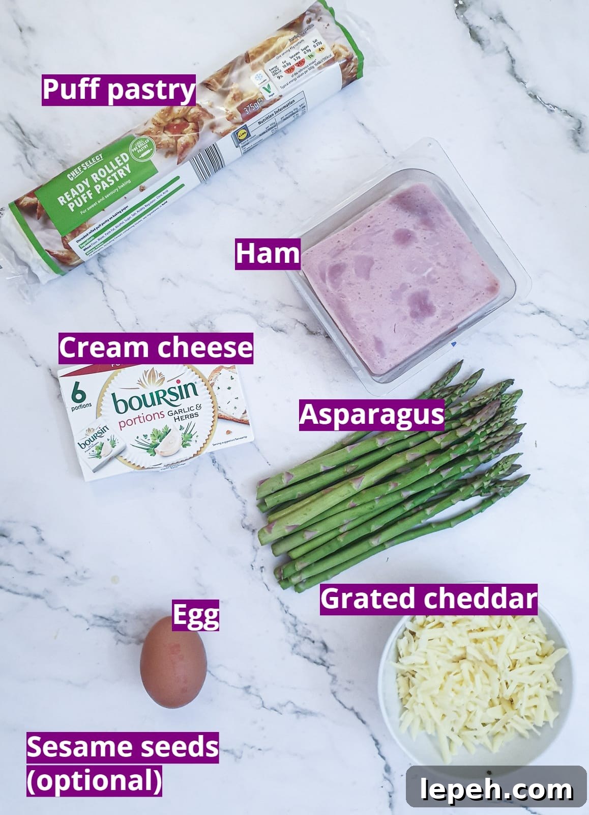 Ingredients for puff pastry asparagus and ham wraps with cheese.