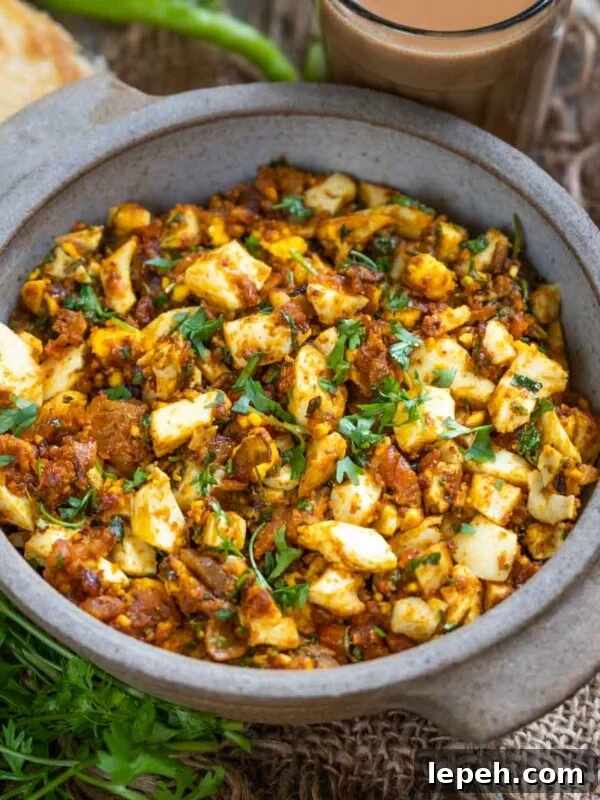 A bowl of spicy Boiled Egg Bhurji garnished with fresh cilantro.