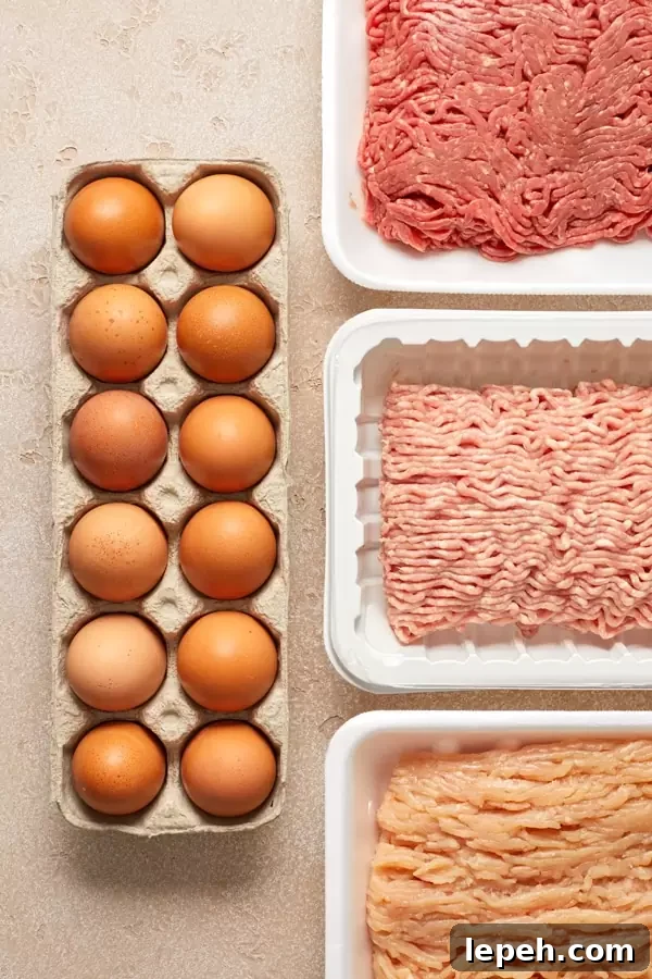 Eggs and ground meats on a surface.