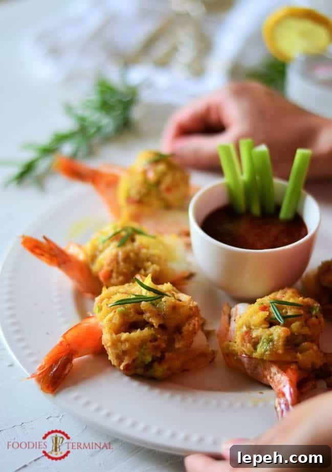 Easy Baked Stuffed Shrimp with Crabmeat & Ritz crackers served on a plate.
