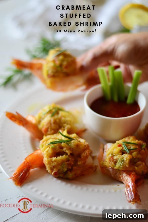Easy Baked Stuffed Shrimp with Crabmeat & Ritz crackers served on a plate held with hands.