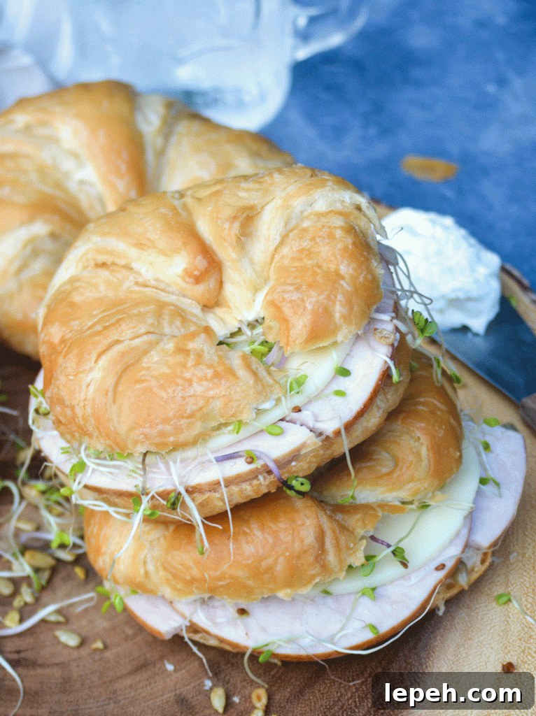two nutty bird sandwiches stacked on top of each other