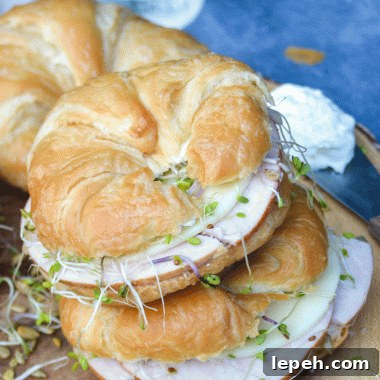 two nutty bird sandwiches stacked on top of each other