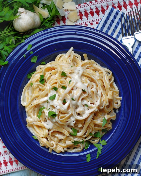 Easy fettuccine Alfredo with creamy sauce made of garlic & Parmesan