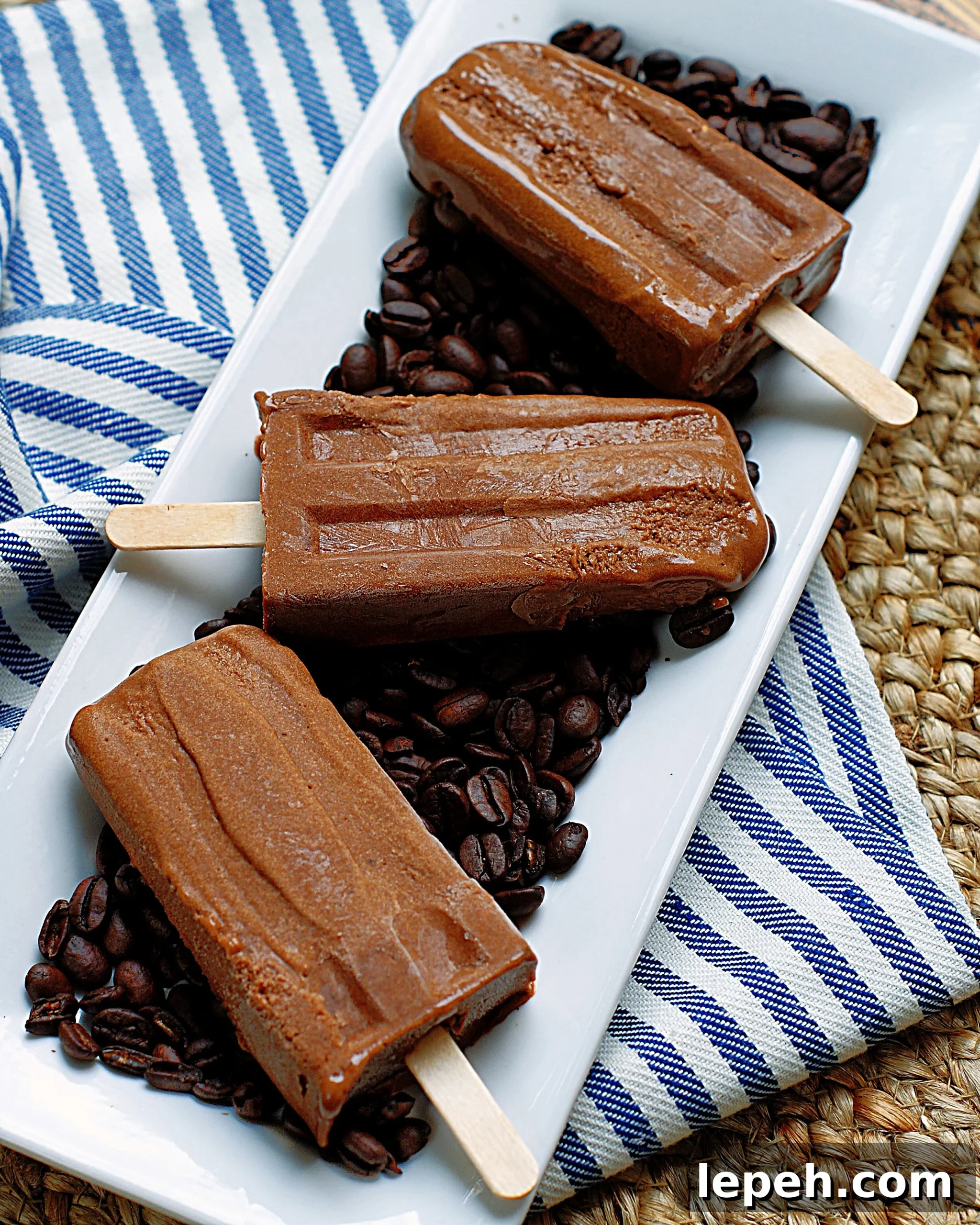 3 mocha fudgesicles on coffee beans