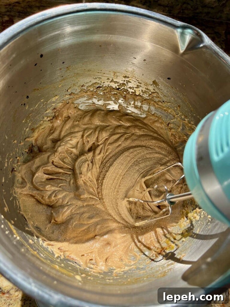 Wet ingredients mixed together with a hand mixer.