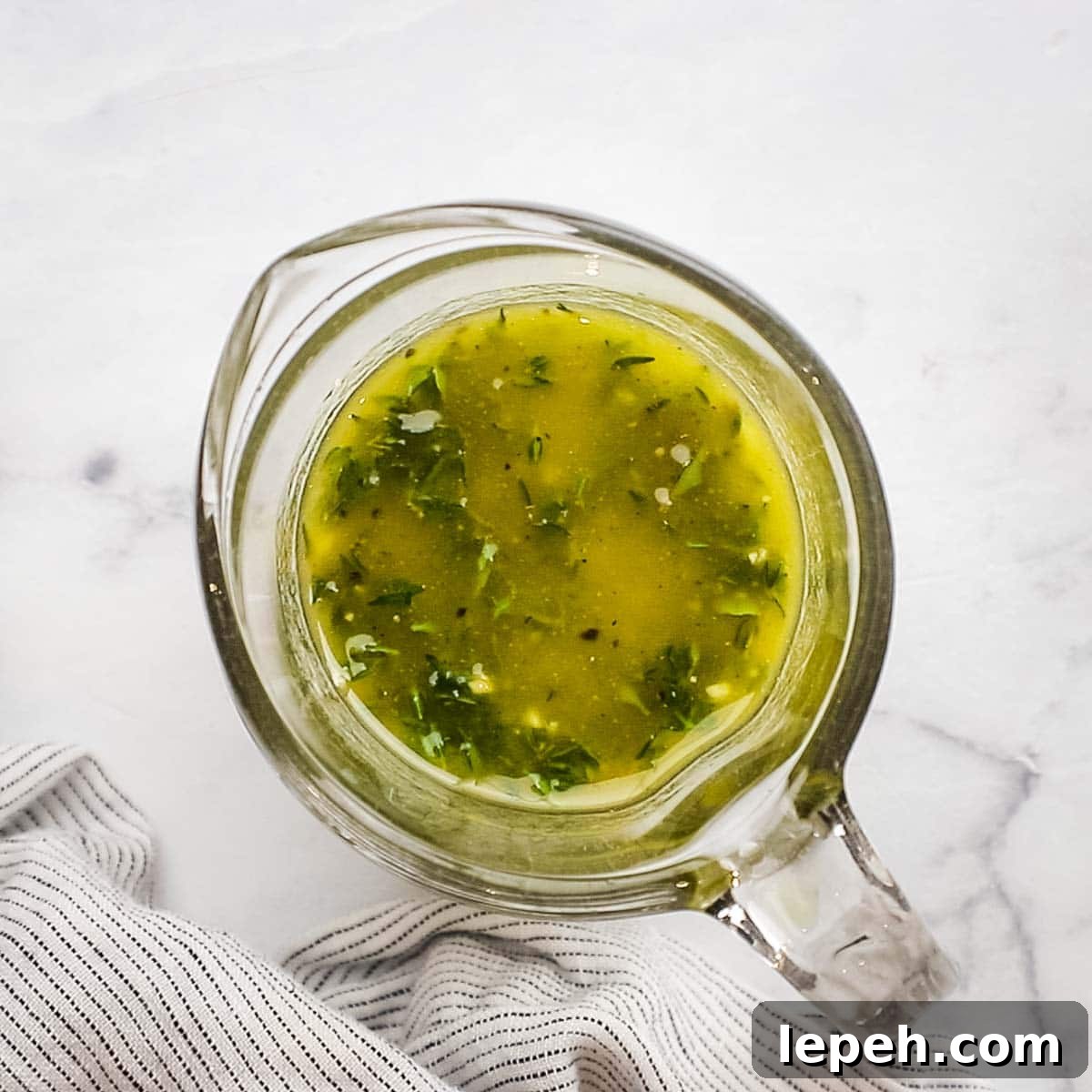 marinade ingredients mixed in a measuring cup