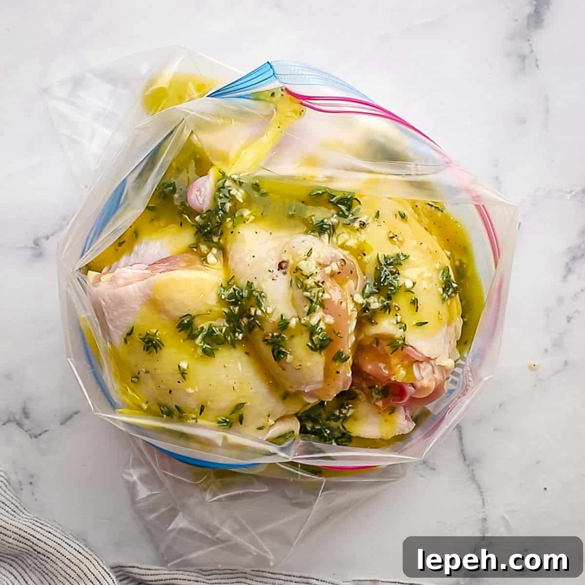 chicken and marinade added to a resealable plastic bag