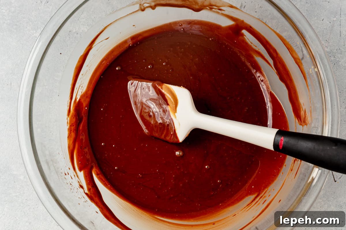 melted dark chocolate, peanut butter, and coconut oil in a bowl