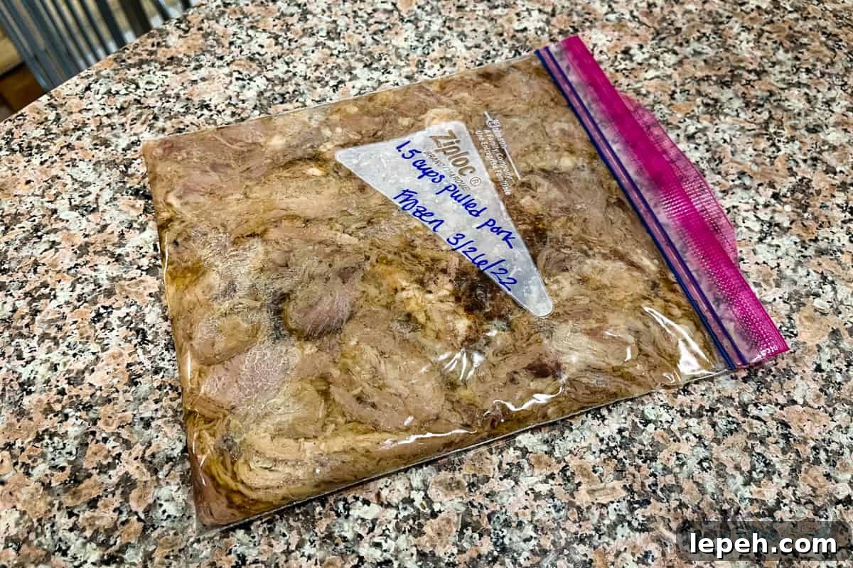 Labeled quart bag of leftover pulled pork on counter