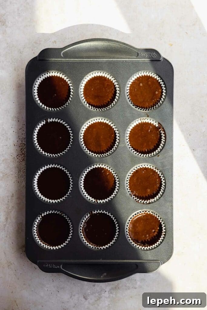 raw chocolate batter in cupcake tin