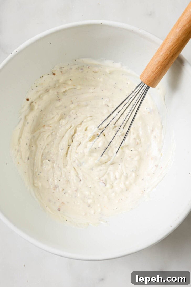 Mayo mixture whisked in a bowl for Chicken Sandwiches.