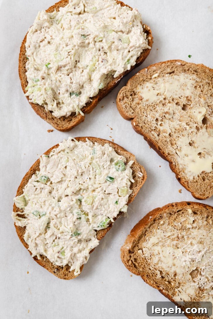Chicken filling spread on buttered multigrain bread.