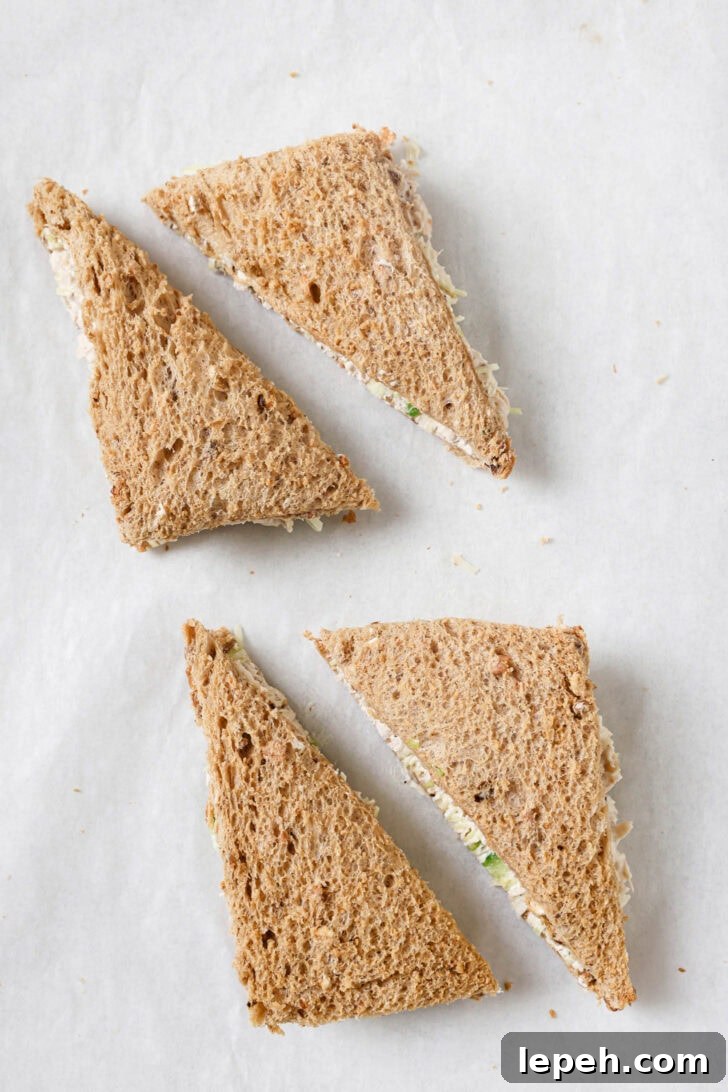 Chicken Sandwiches cut into triangles with crust removed.