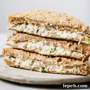 Close up of a stack of Chicken Sandwiches on a plate.