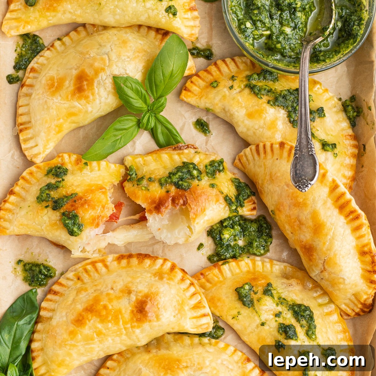 This is a square picture of caprese empanadas.