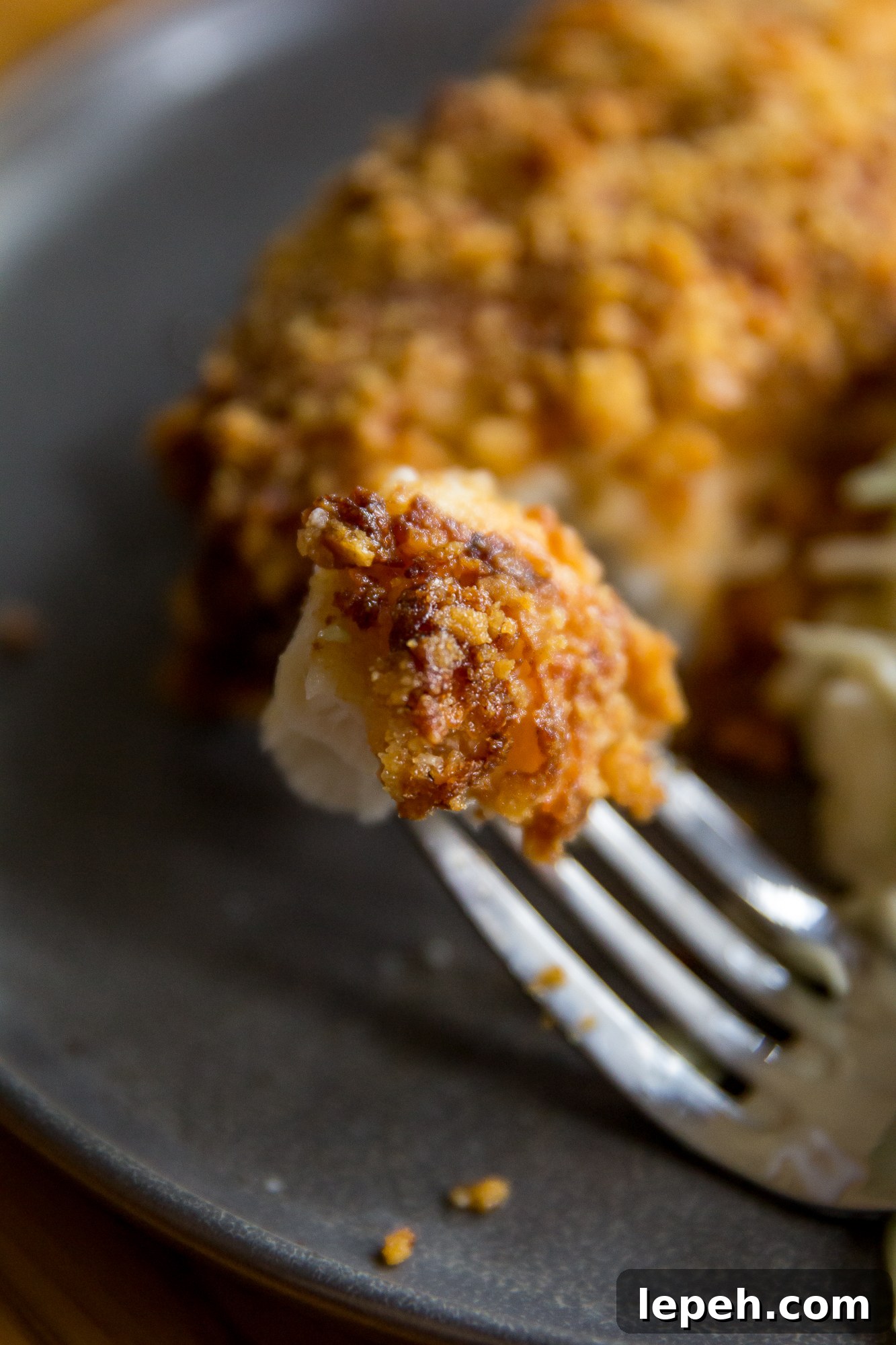 Bite of Air Fryer Parmesan Crusted Halibut on a fork