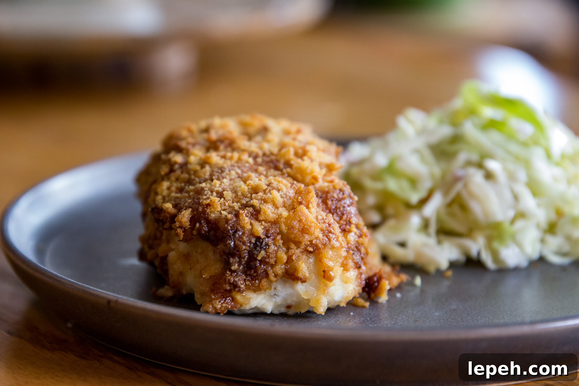 Air Fryer Parmesan Crusted Halibut on a plate with coleslaw