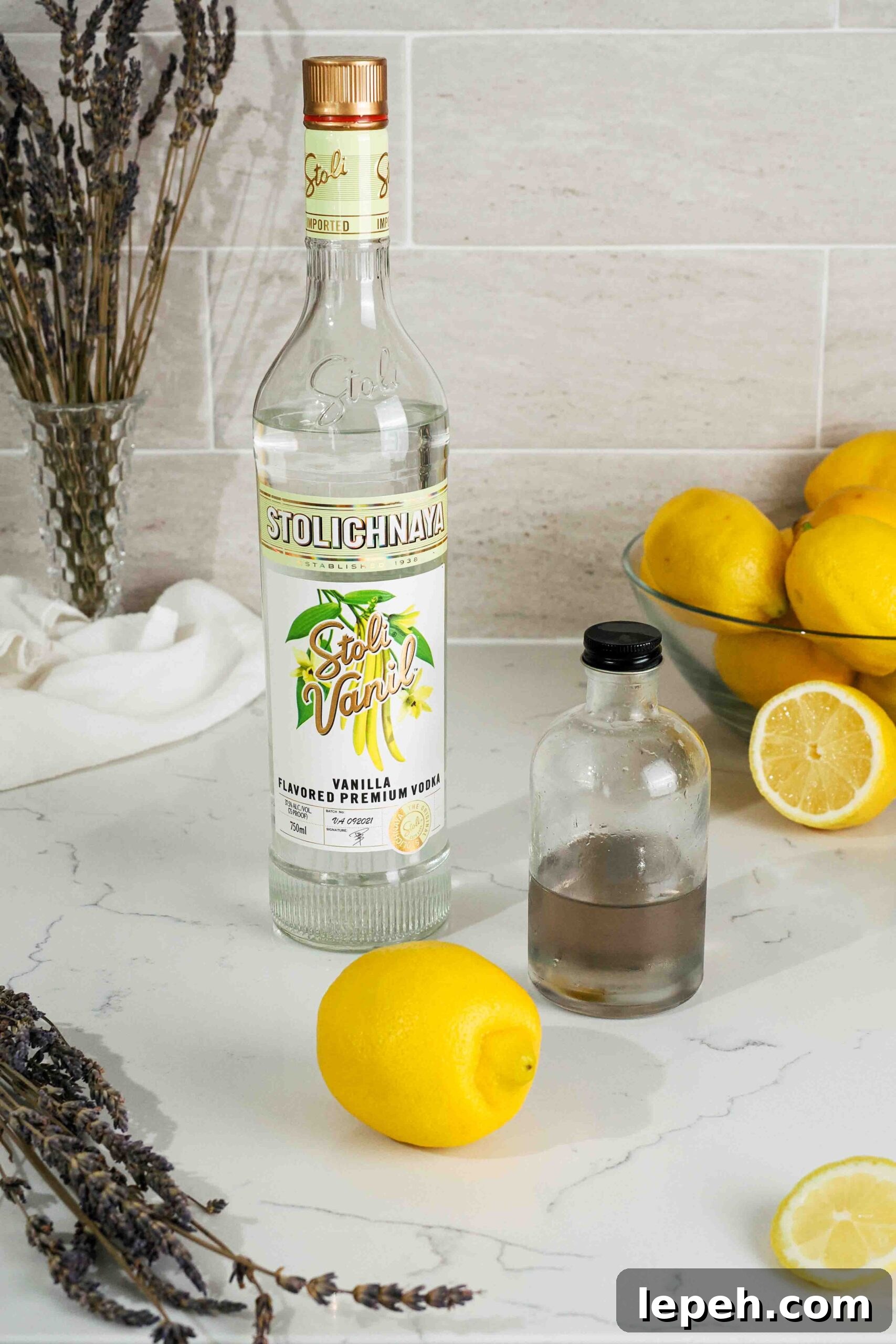 Ingredients for lavender lemon drop martini on a counter.