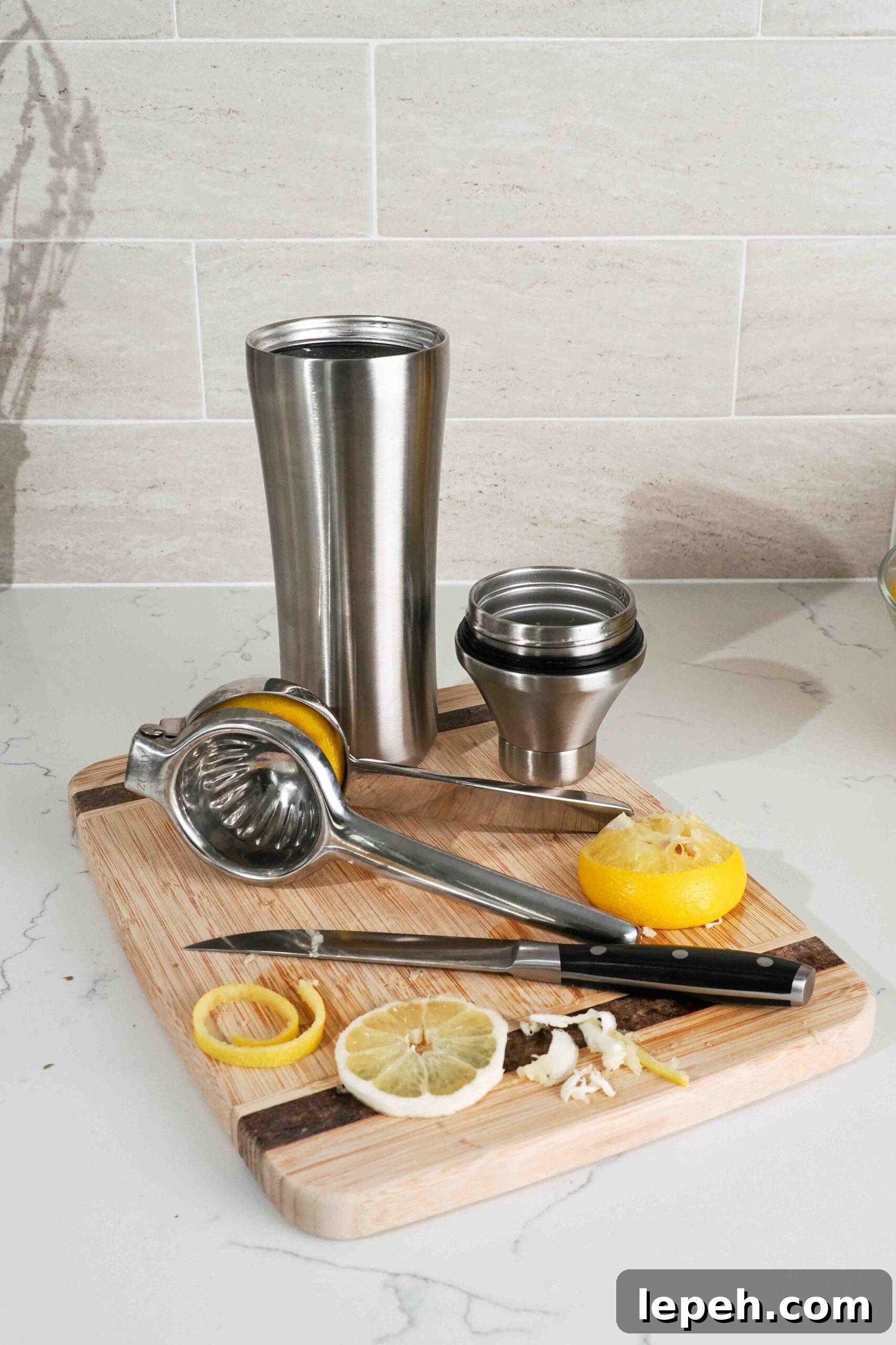 Dishes for making lavender lemon drop martini on a counter.