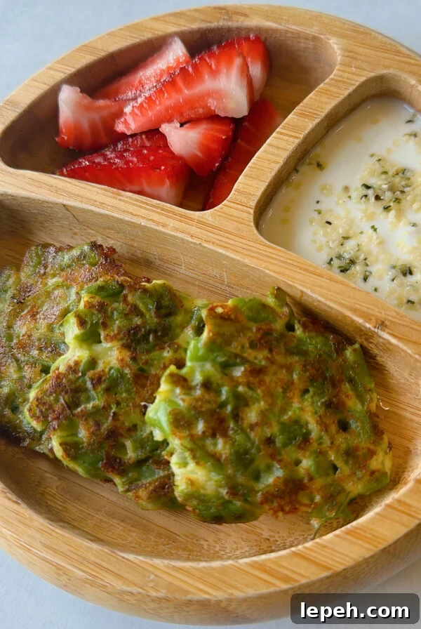 Green bean fritters served with strawberries and yogurt dip.