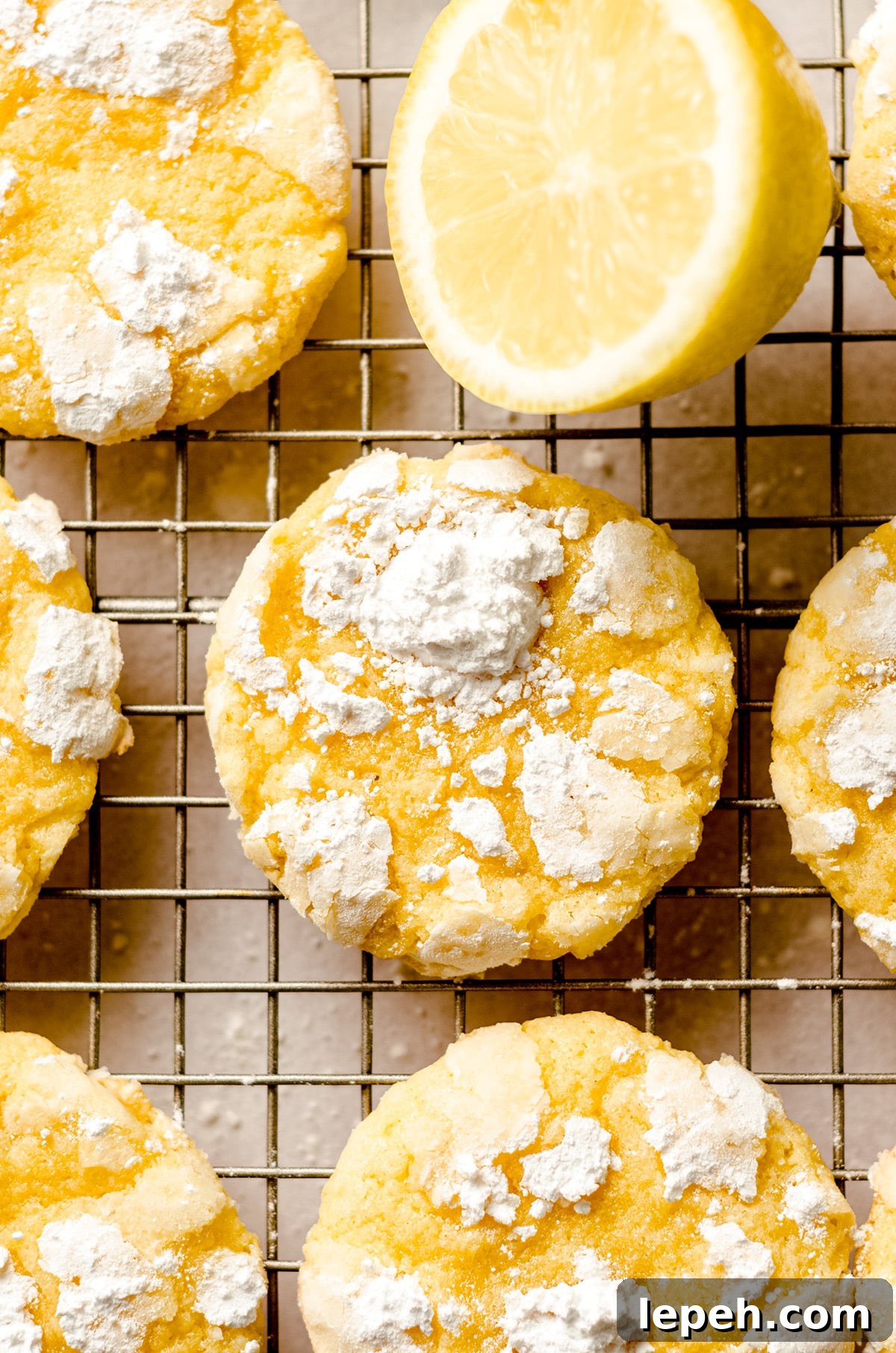 lemon crinkle cookies on a cooling rack