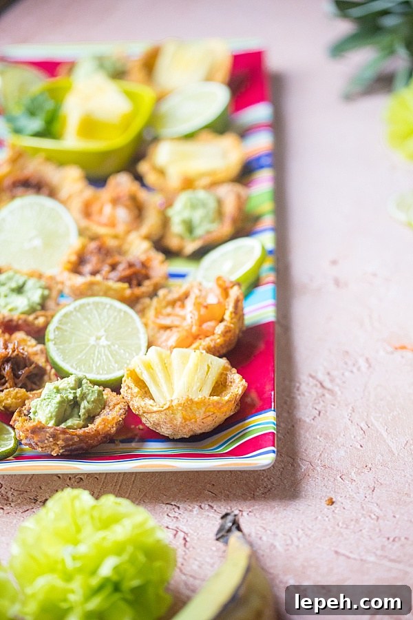 closeup of a fried plantain cup with pineapple and guacamole