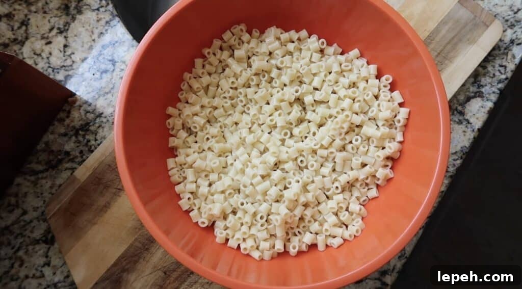 Cooled and rinsed pasta in a very large mixing bowl