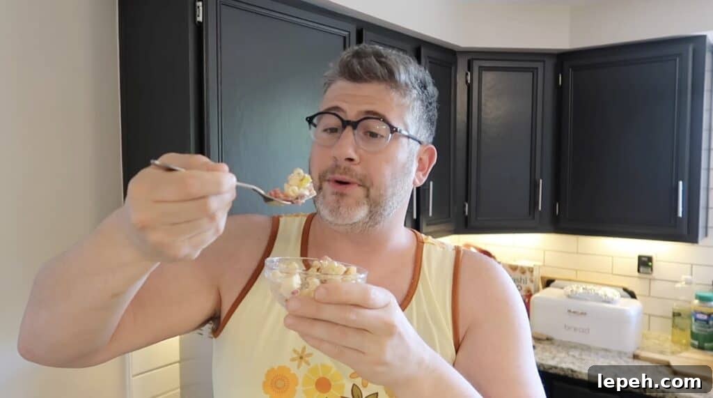 Man with forkful of pasta