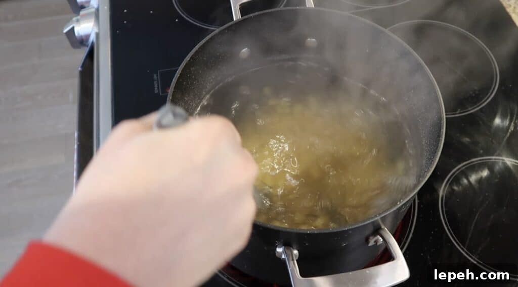 Stirring pasta as it boils