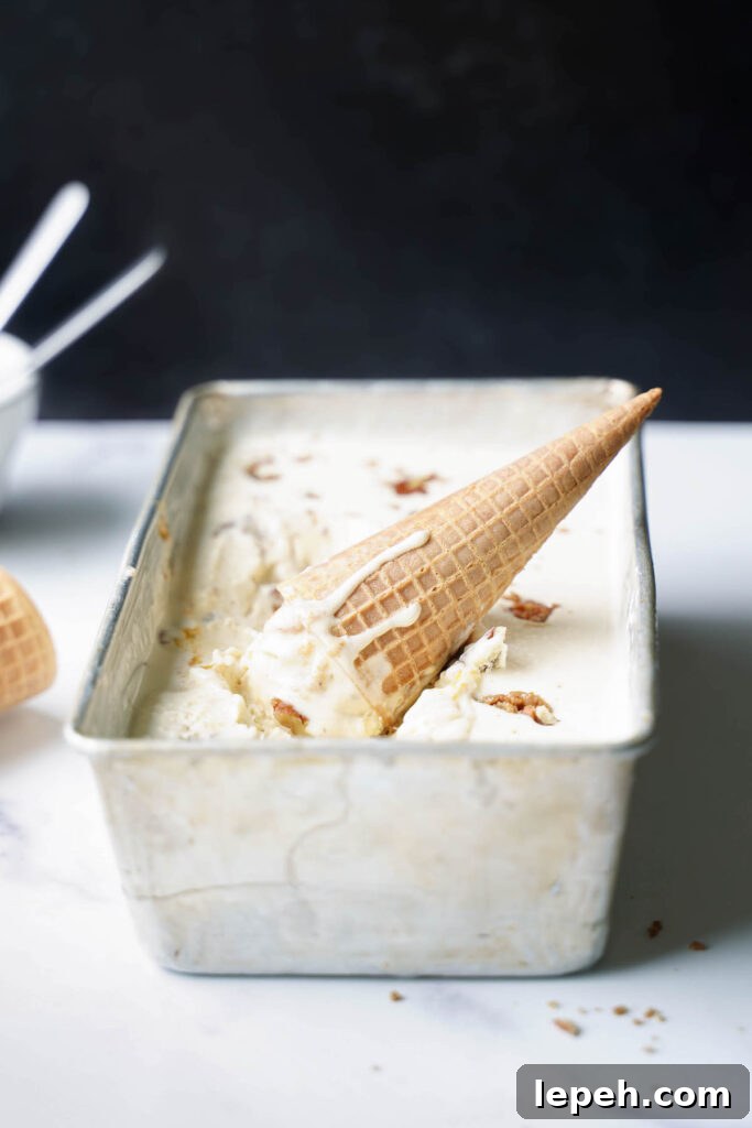 An ice cream cone melting into a pan of no-churn ice cream