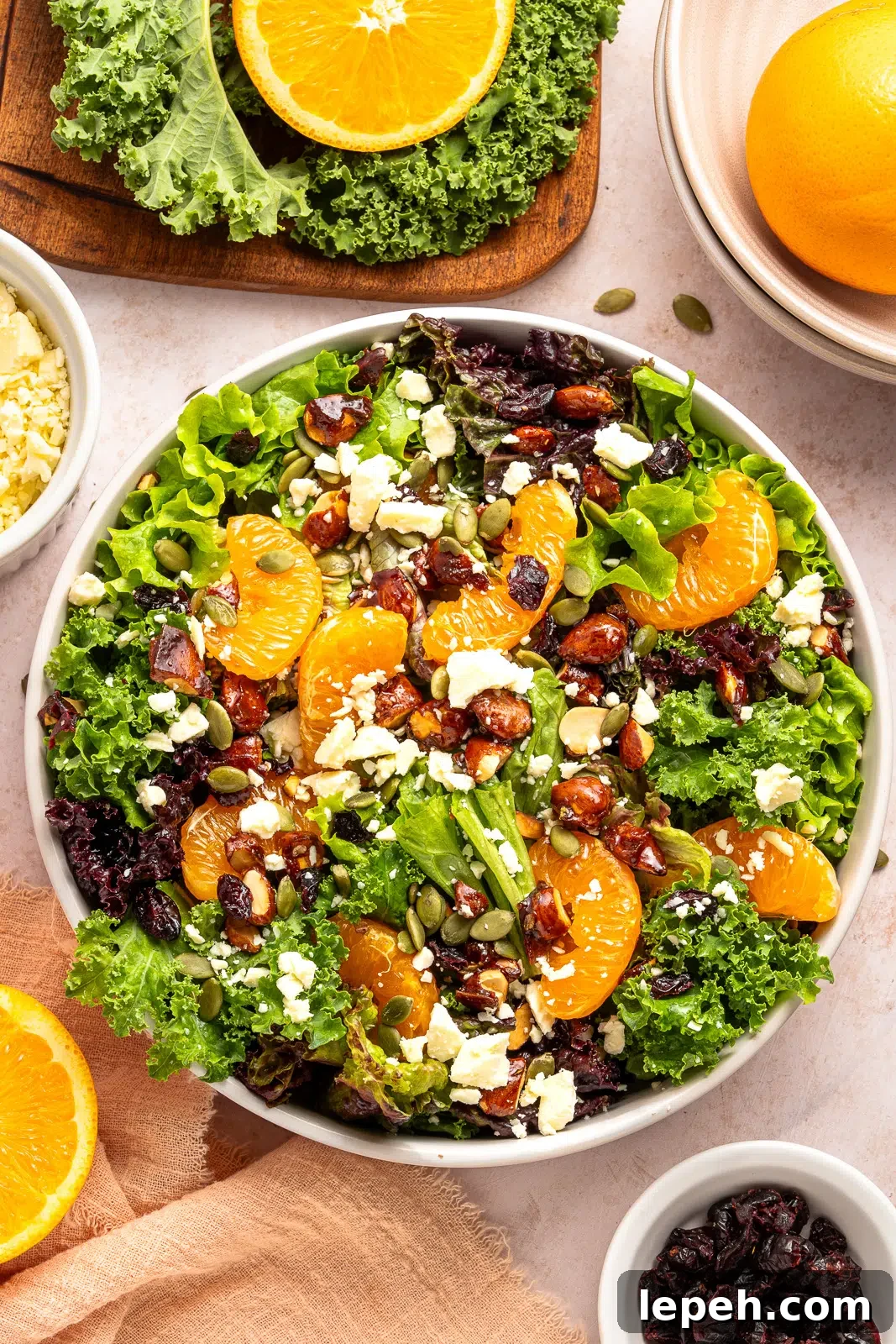 citrus salad with mixed greens in a bowl