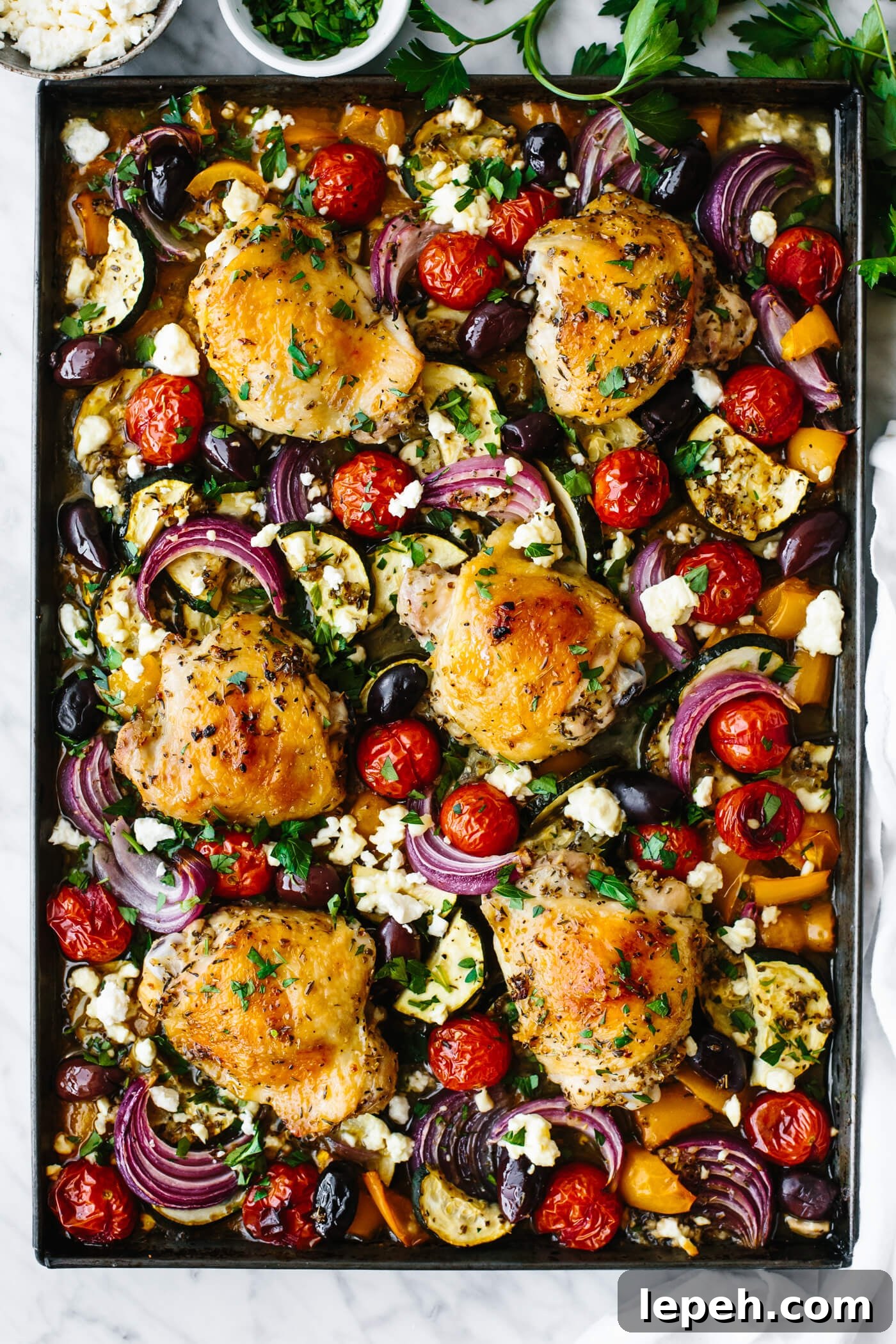 Greek sheet pan chicken with vegetables.