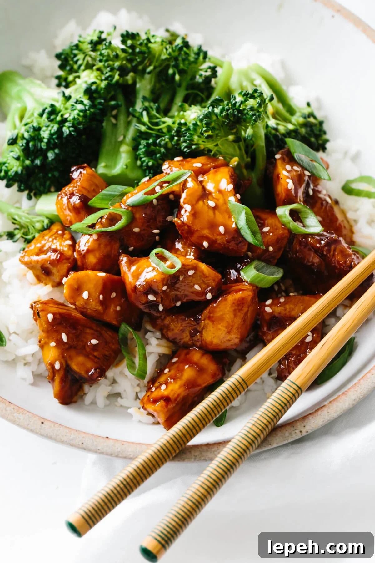 Teriyaki chicken recipe served with rice and broccoli.