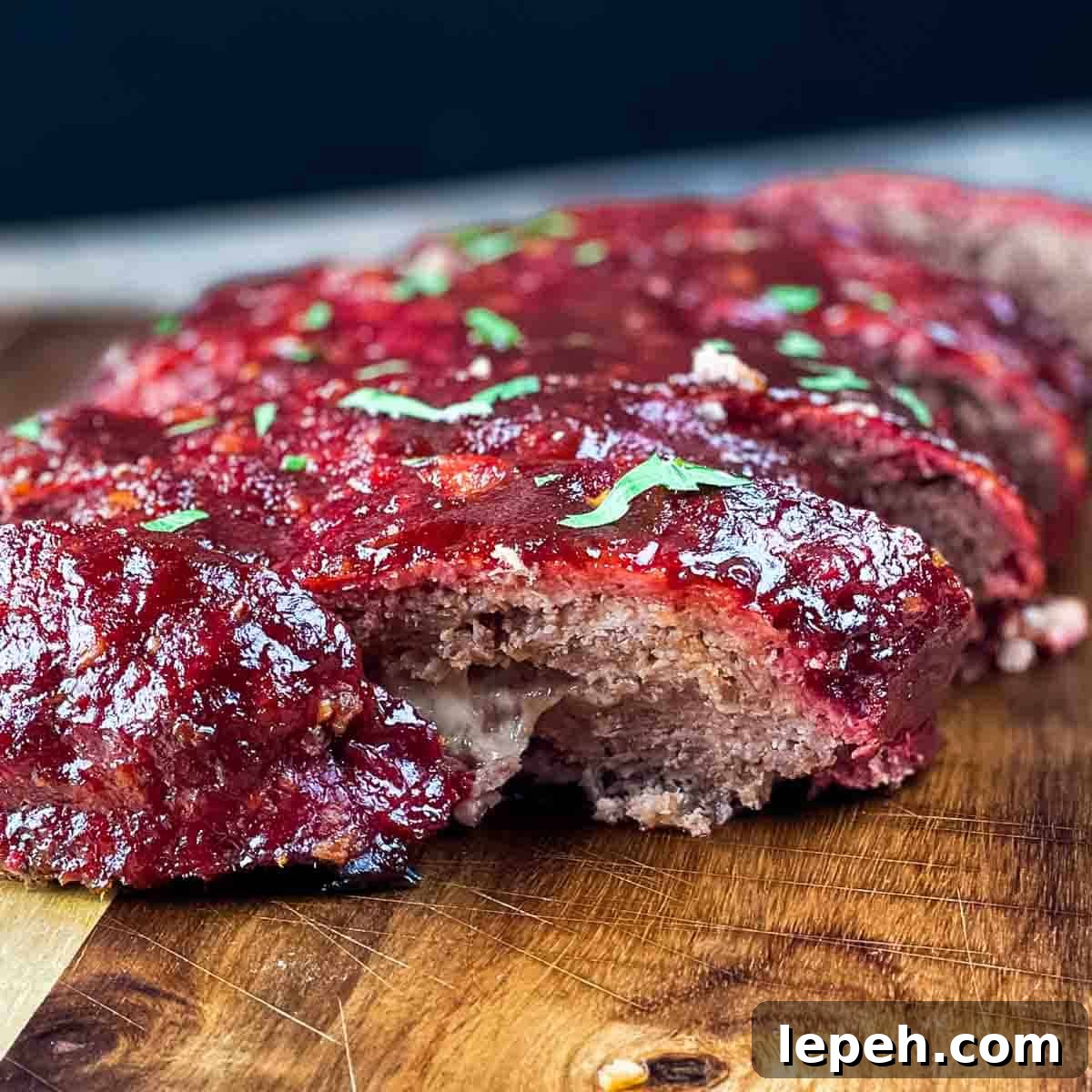 The smoked meatloaf cut into slices for serving.