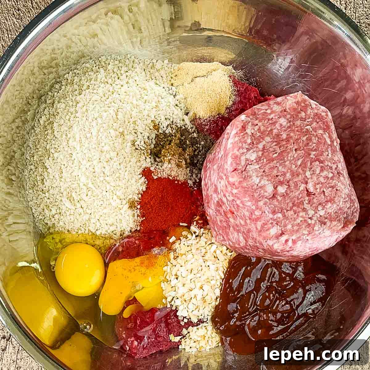 The ingredients for the smoked meatloaf in a large mixing bowl.