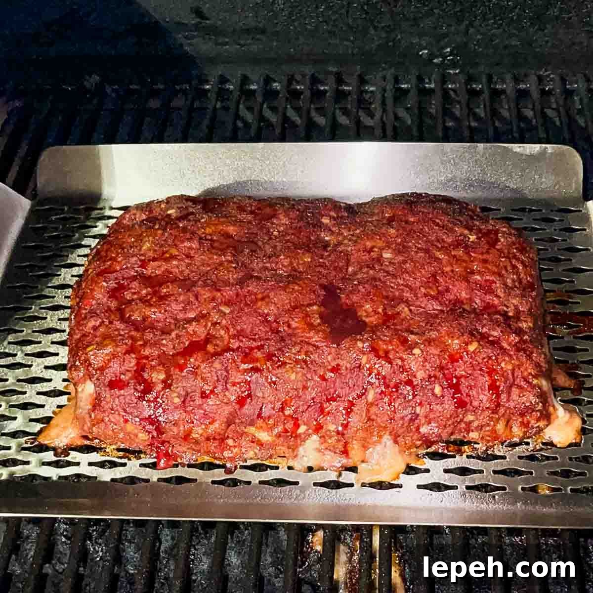 The meatloaf after two hours of smoking, just before the glaze is applied.