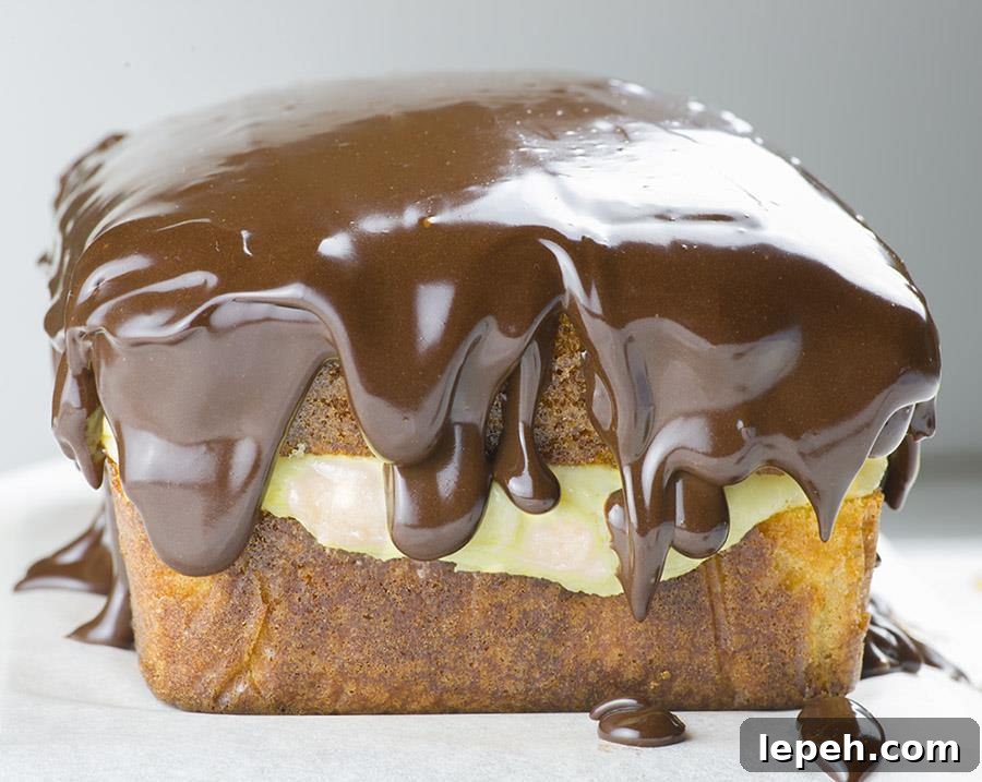 Boston Cream Pie Pound Cake - magnificent, smooth and creamy filling with vanilla flavor sandwiched between two cake layer, topped with rich chocolate ganache! Winning combo!